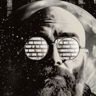 Man with beard and sunglasses that look like brick walls